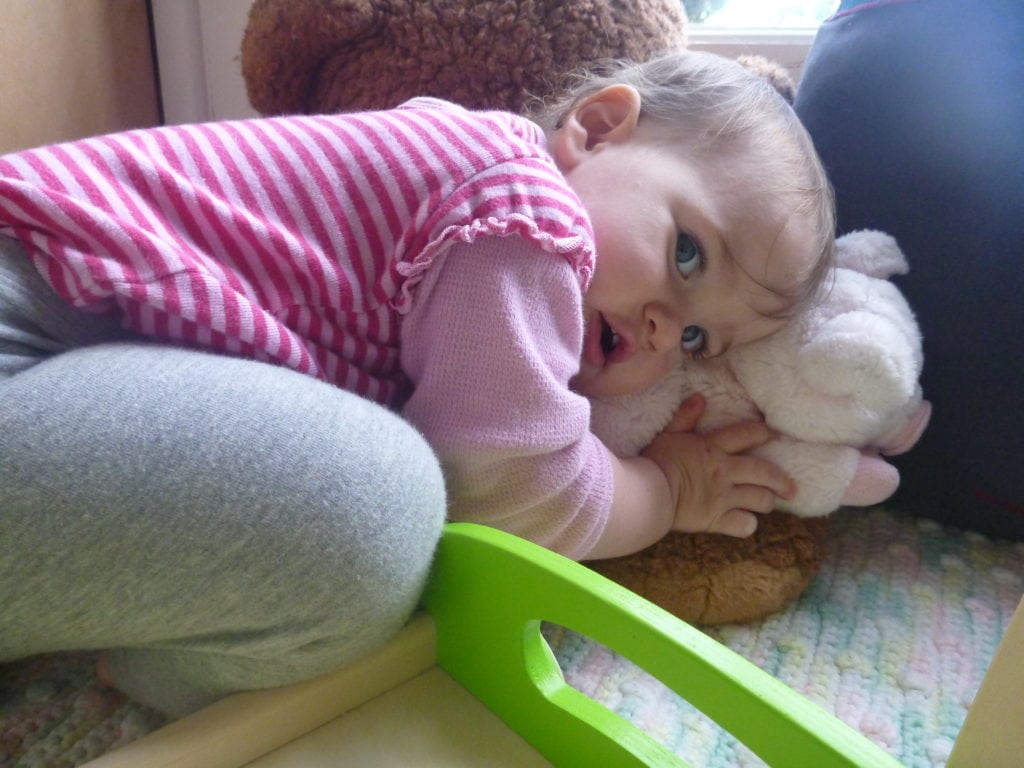 Naptime fears - toddler snuggles lovie from home for comfort