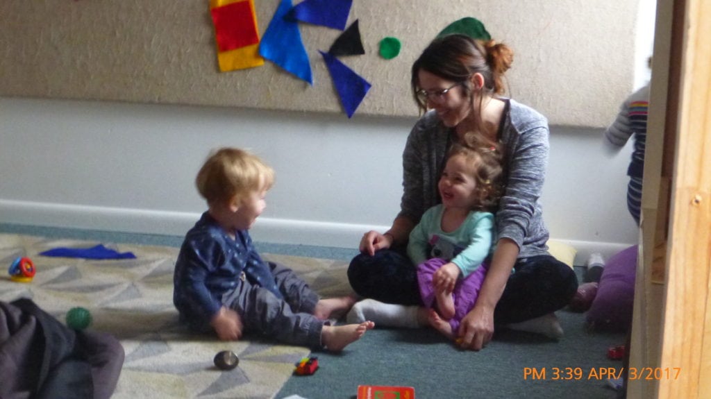 what is high quality early childhood - primary caregiver builds relationships with tots through joyful moments