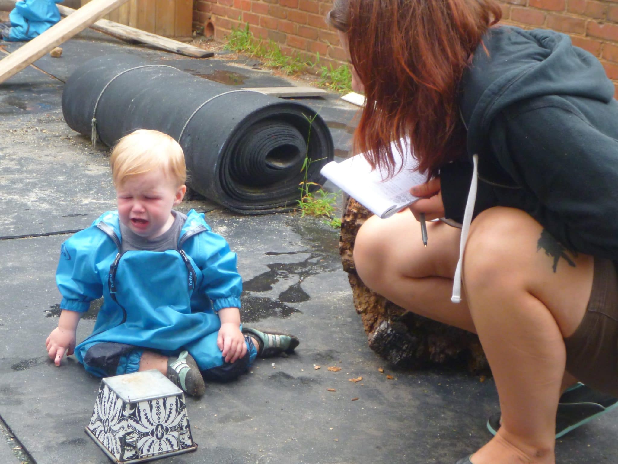 Playing outside and talking through problems with a teacher.