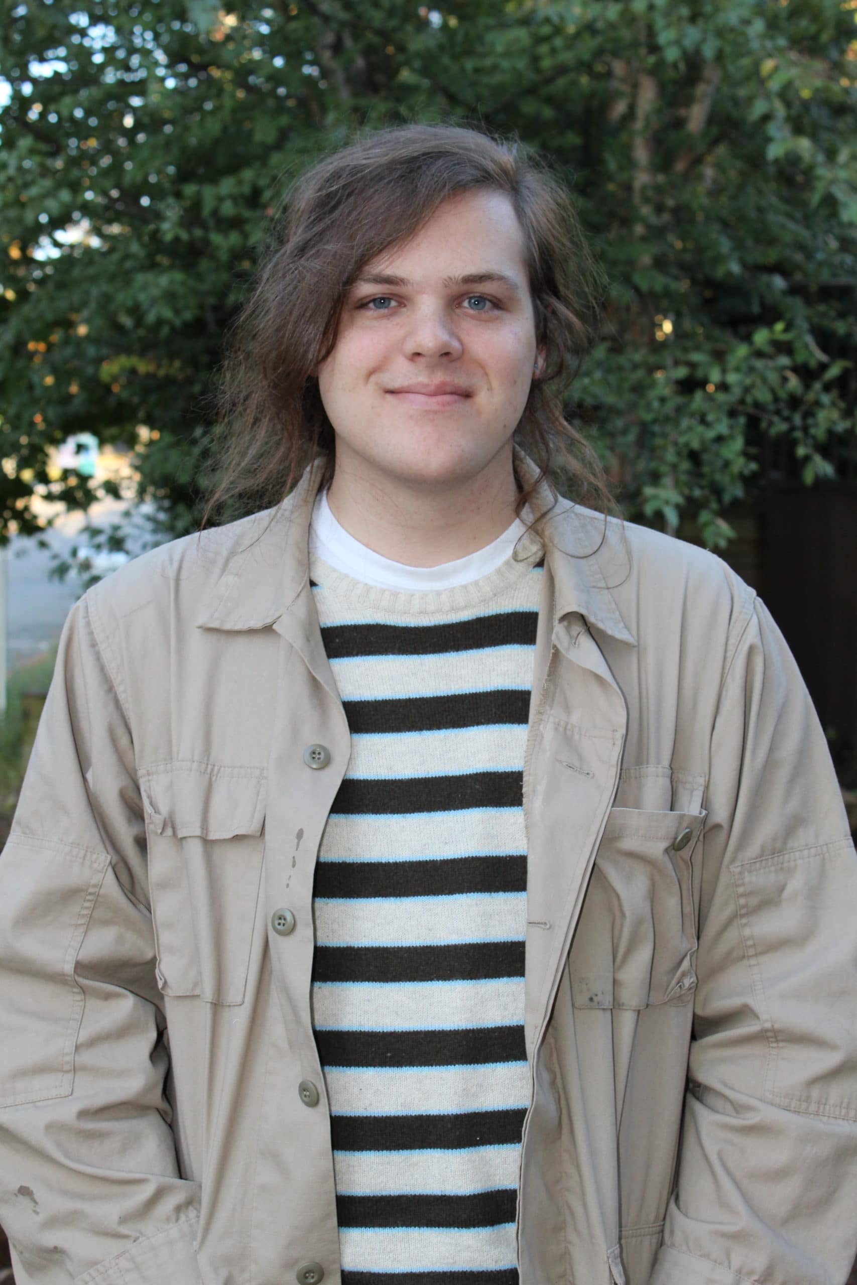 Shane Shane smiles with no teeth, tree, stripes, jacket