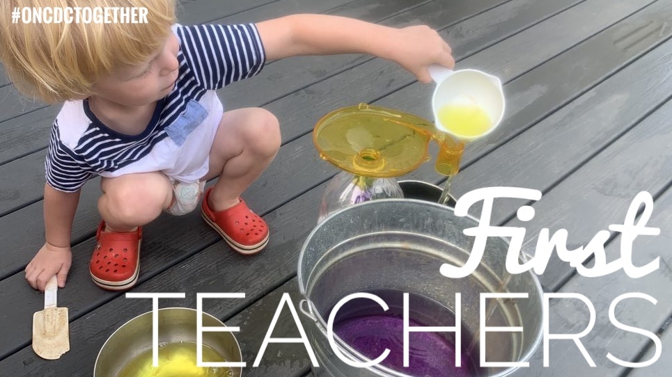 Reggio inspired toddler playing with colored water containers. Text reads First Teachers and hashtag ONCDC together.