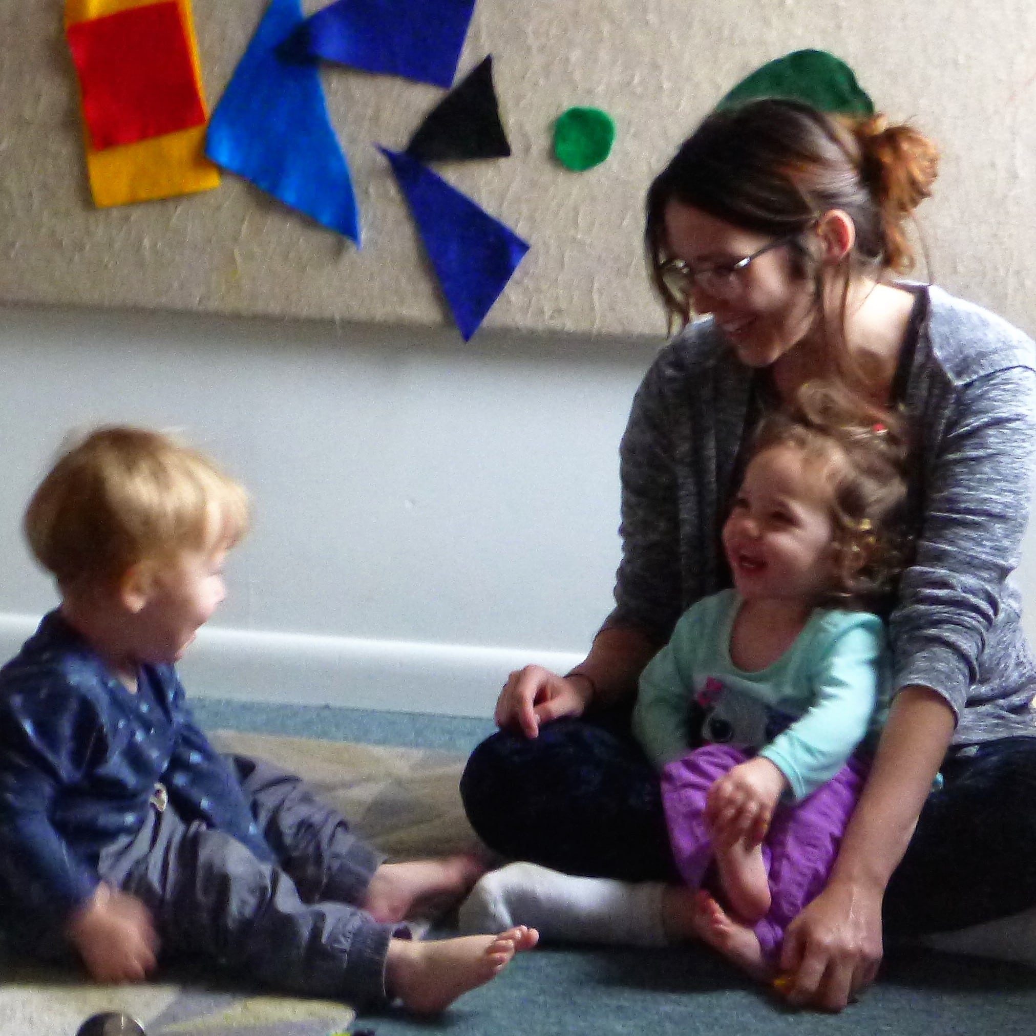 sq what is high quality early childhood - primary caregiver builds relationships with tots through joyful moments